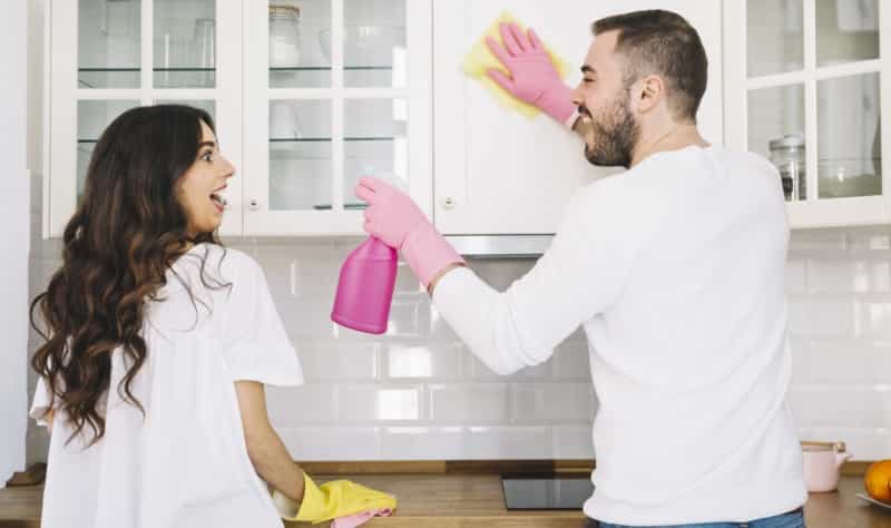 young couple sprucing up their kitchen