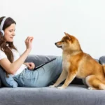 woman playing with her dog on a couch