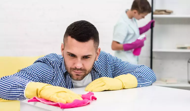 young man cleaning house with his son