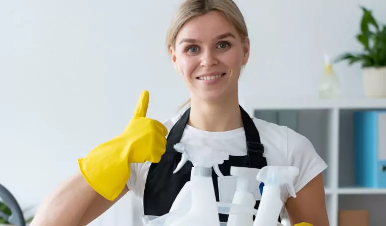 woman with some cleaning products ready for cleaning