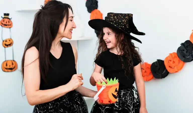 A lady and a girl enjoying Halloween party