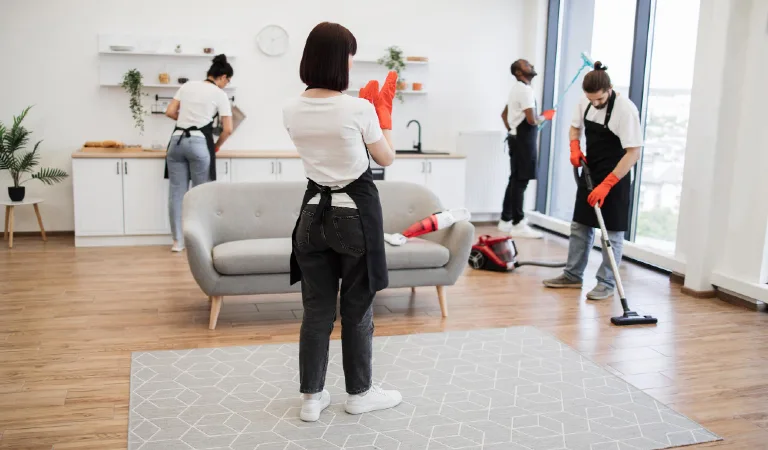 Female boss of company distributes tasks to employees