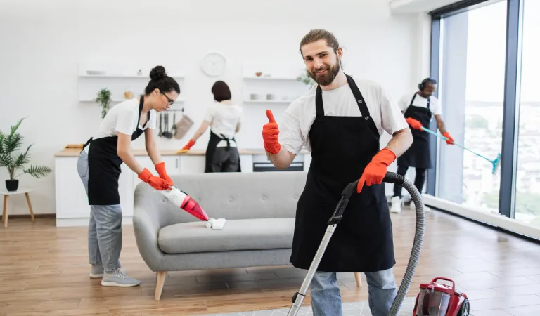 professional bearded cleaner from cleaning service vacuums carpet